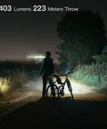 Cyclist using UltraBright USB C Rechargeable Handheld Flashlight With XHP35.2 LED High Lumen Output for night ride