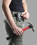 Person using Heavy Duty Magnetic Tool Belt Holster With Hammer Loop Belt Clip to hold hammer and nails securely on belt.