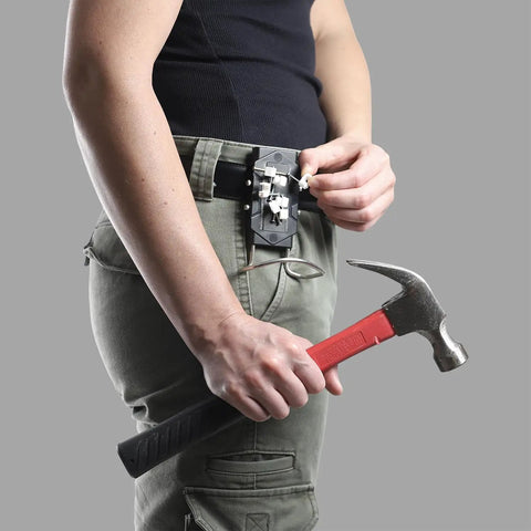 Person using Heavy Duty Magnetic Tool Belt Holster With Hammer Loop Belt Clip to hold hammer and nails securely on belt.
