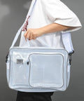 Clear Antistatic Crossbody Tool Bag Hella Durable Cold Pvc Build For Field Engineers And Tech Crews Straight Up Reliable Gear And Laptop Storage Heavy Duty Protective Case held by a person.