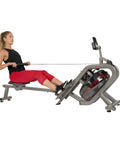 Woman using Phantom Hydro Water Rowing Machine With Realistic Water Resistance 60 Degree Tank 16 Hydro Blades for workout