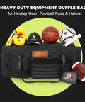 Beefy 130L Extra Large 36 Inch Heavy Duty Gym And Travel Duffel Bag Built To Haul Mega Sports Gear From Basketball And Baseball To Hockey Football Helmets And Pads Durable Oversized Gear Bag Black holding sports equipment