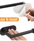 Matte Black Stainless Steel Toilet Paper Holder With Adhesive Mount, showing peel-off sticker and hand pressing for easy install.