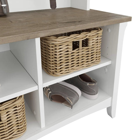 Close-up of Salinas Hall Tree With Shoe Storage Bench In Shiplap Gray And Pure White with baskets and shoes in cubby shelves.