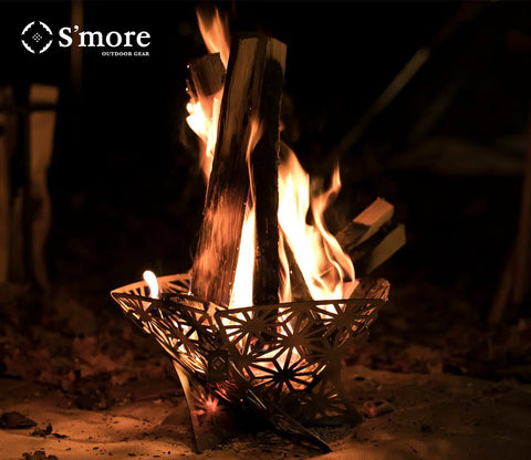 Portable Camping Fire Pit With Grill For Cooking, Outdoor Stove With Storage Bag, sturdy steel design with burning logs.
