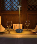 Cordless Table Lamp With 6000mAh Battery, Portable LED Desk Light on dining table, modern triangle design, dimmable light in dark wood room
