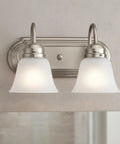 Brushed Nickel 2 Light Vanity Bath Light with Satin Etched Glass Shades, sleek modern bathroom fixture, mounted on wall.