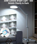 Lit LED Magnifying Lamp With Stand And Rolling Base, 4.9 Inch Lens, 2,200 Lumens, spotlighting a room setting, stepless dimmable