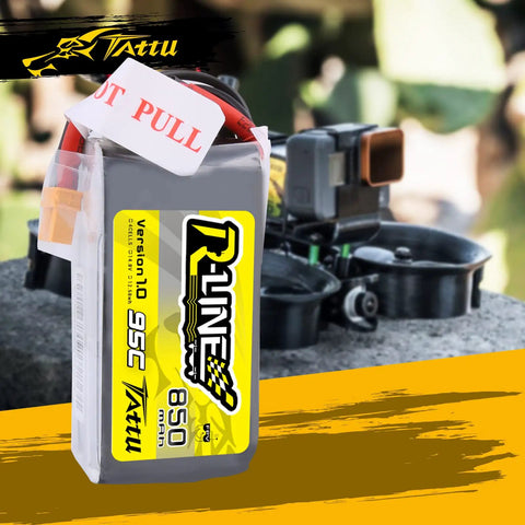 R Line 850mAh 14.8V 95C 4S LiPo Battery Pack With XT60 Plug for multirotor FPV drones with racing drone in background
