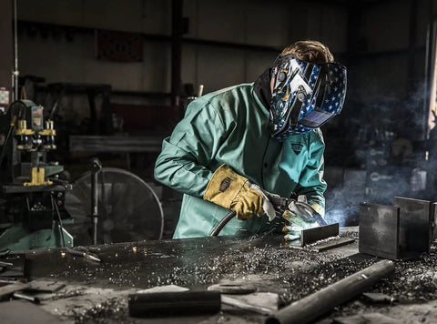 Welder wearing Goatskin and Cowhide MIG Welder Gloves Pack of 12, Kevlar-Trimmed, fleece-lined, medium, in action at metalwork.