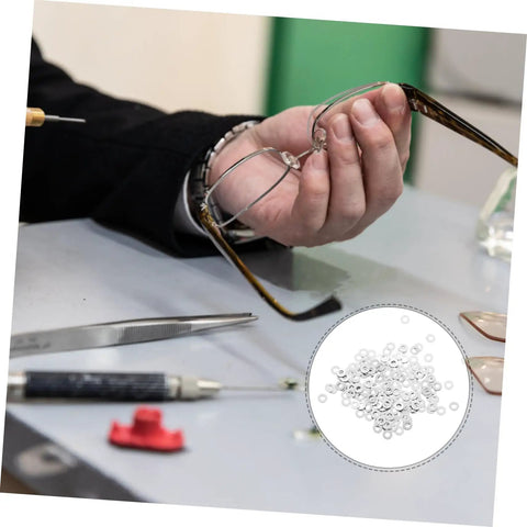 Person repairing rimless eyewear with Eyeglass Screw Gaskets And Metal Washers For Rimless Frames Durable Eyewear Fix Kit