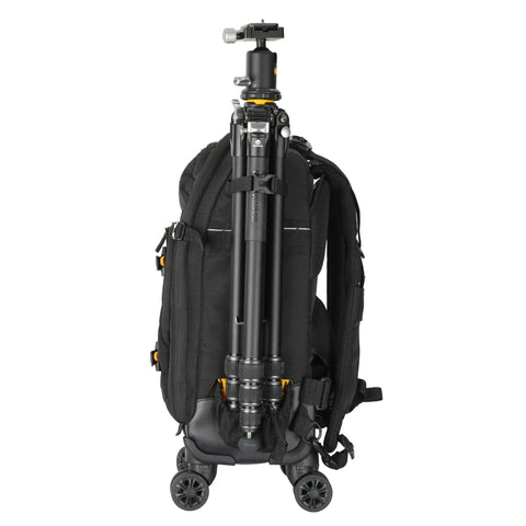 Eight Wheel Spinner Camera Backpack For DSLRs And Gear With Tuckaway Harness Converts To Everyday Pack showing tripod attachment.