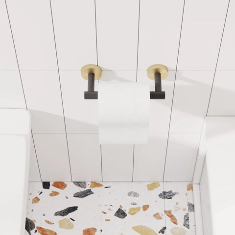 Matte Black And Brushed Brass Finish Double Post Pivoting Toilet Paper Holder Built Tough From SUS304 Stainless Steel Wall Mounted Tissue Holder For Commercial Bathrooms And RVs, mounted on white tile wall.