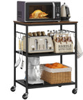 Smooth Rolling 3 Tier Kitchen Microwave Cart Sturdy Steel Build Easy Glide Casters Coffee Bar Station with microwave and utensils.