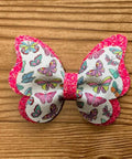 Colorful butterfly bow from 1 Set Butterfly Bow Tie Metal Die Cuts For DIY Scrapbooking And Card Making, on wooden background.