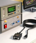 DeStatix A9 FTDI USB to RS232 Adapter With 9 Status LEDs beside industrial equipment showing DB9 and USB connections.