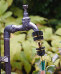 Three Quarter Inch Garden Hose Quick Connectors Kit, Aluminum Male And Female Quick Connect Fittings attached to outdoor faucet.