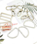 15 Piece Top Shelf Metal Swivel Snap Hooks And D Rings With Tri Glide Slide Buckles For Lanyard Purse Bag Straps And Dog Collars Straight Up Diy Sewing Hardware Kit In Smooth Silver arranged on a white background.