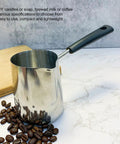 Turkish Coffee Pot And Milk Frothing Jug 21oz 600ml Stainless Steel Toroid Pitcher With Long Handle on a counter with coffee beans.