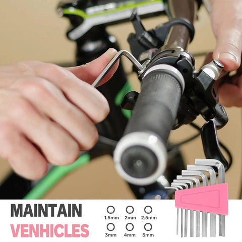 Close-up of hands using 39 Piece Household Tool Set For Home, Garage, Office And Dorm Pink, Pro Grade DIY Essentials, on a bicycle handlebar adjustment.