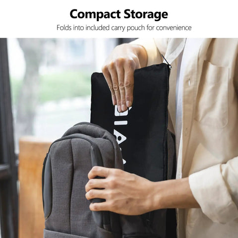 Person storing Waterproof Car Seat Travel Bag With Straps Wearable Design Padded Large-Capacity Check Bag into a backpack