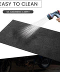60 By 36 Inch Oil Spill Mat For Garages And Driveways, Heavy Duty Absorbent Floor Pad, being hosed down to clean, easy to wash.