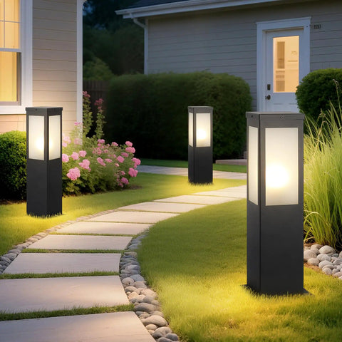 Modern Outdoor Bollard Pathway Lights Rock Solid Black Aluminum Yard Walkway Lamps With Waterproof White Glass hardwired, in garden at night.