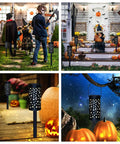Six Pack Solar Powered Outdoor Pathway Lights Waterproof Black Lanterns illuminating garden with Halloween decor and pumpkins