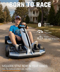 Teenager in a McLaren Licensed 48V Electric Go Kart for Teens 14 Plus with Handbrake parked on a suburban street.