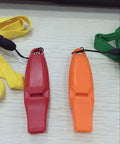 Plastic Pigeon Training Whistle For Racing And Flight Practice, Durable Bird Accessory in Bright Orange and Red, with Yellow Lanyard