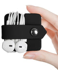 Headphone Case And Cable Organizer For Earbuds And Headphones Cord Winder And Earphone Holder Case Wrap Winder Headset Keeper Cable Manager Portable Silicone Black Cover held in hand