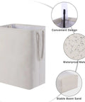 Two Pack Stand Up Laundry Hampers With Built In Lining Detachable Rods, close-up of cream linen material and handy handles.
