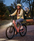 Woman riding Electric City Commuter Bike With 1500W Peak Brushless Motor 48V 15Ah Removable Battery Up To 80 Miles And 20 Plus MPH 26 Inch Step Through Ebike For Men And Women 7 Speed Daily City Cruiser Ride on evening path