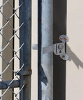 Fork Gate Latch For Chain Link Fence 1-3/8 Inch Wall Mount Flat Back With Padlock Hole And Screws Included, mounted on fence
