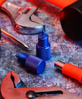 Solid Aluminum Two Piece Brake Proportioning Valve Bleeder Tool Kit For Disc And Drum Systems With Pv2 Pv4 Shuttle Valve Compatibility showing blue metal tools on work surface.