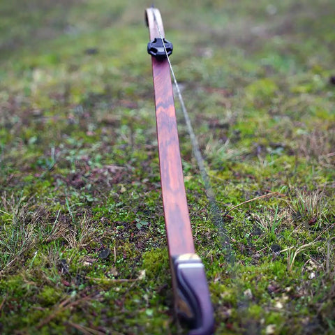 Low-Profile Recurve Dampener Kit For Recurve And Youth Solid Limb Compound Bows, Quiet Vibration Reduction with NOVCOM Technology in grass.