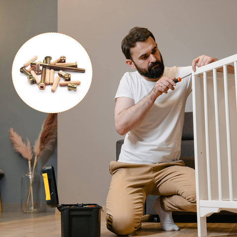 Man assembling crib using Must Have Hardware Replacement Kit For Cribs And Furniture With Barrel Nuts And Wood Dowels.