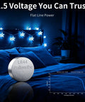 Thirty Pack LR44 Button Coin Batteries AG13 A76 L1154F SR44 Compatible Gadgets With One Point Five Volts Alkaline Power on a blue bed.