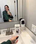 Portable Space Heater With Remote, 500W Ceramic Electric Heater shown on bathroom counter, sleek compact design with box