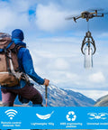 Upgrade Your Drone Game With This Awesome Universal Claw Grabber for DJI Drones Smart Manipulator Tool Easy Insta Mount For Mavic Mini Air Drop Airdrop Accessory Perfect For Hauling Stuff And Heavy Lifting Missions In Style, drone lifting a water bottle in a mountainous area.