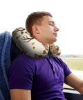 Man using Cartoon Family Owls On The Brown Tree U Shaped Travel Pillow With Memory Foam Core on a bus for comfort.