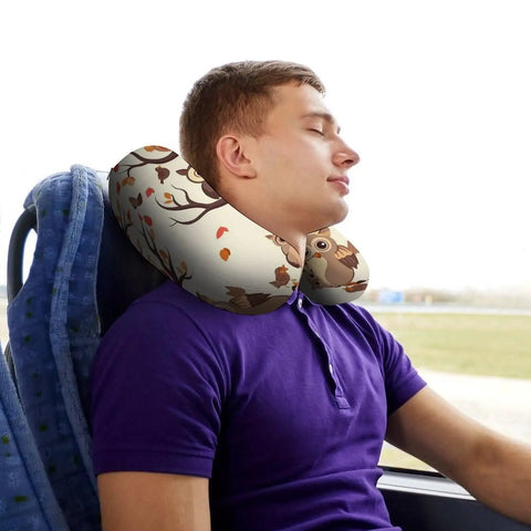 Man using Cartoon Family Owls On The Brown Tree U Shaped Travel Pillow With Memory Foam Core on a bus for comfort.