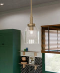Top Shelf Champagne Bronze Mini Pendant Light With Clear Glass Shade For Kitchen Island, 15-inch fixture with adjustable drop chain.