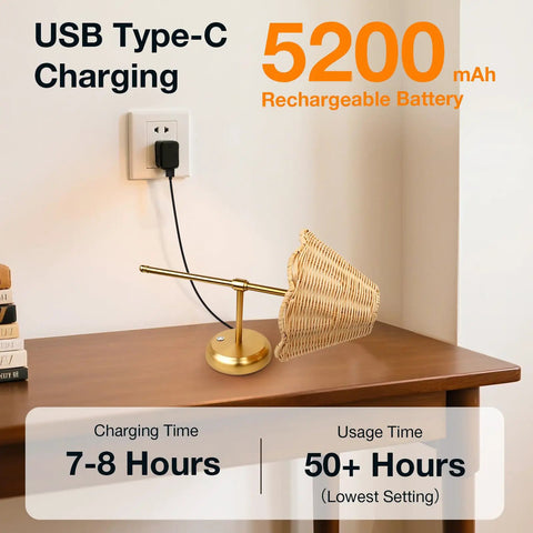Wireless Boho Rattan Wall Sconce Set of Two, USB Type-C charging, 5200 mAh battery, sleek brass finish on a table.