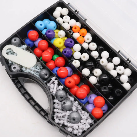 Open box of Pro Grade Organic Chemistry Molecular Model Kit with 303 pieces, showing colorful atoms, bonds, and link remover tool.