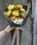 Hand holding yellow flower bouquet in Dope Bouquet Wrapping Paper 10 Yard Colored Linen Look Gift Wrap For Floral Arrangements.