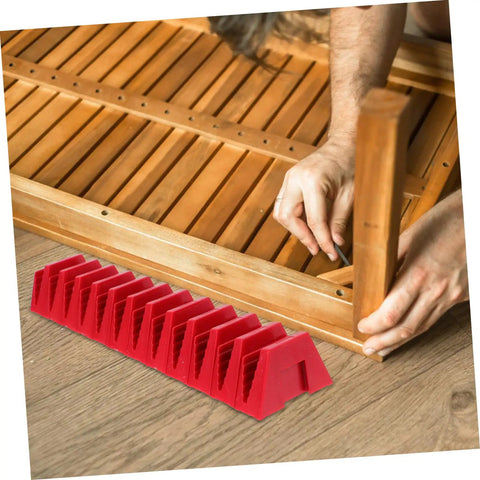 Red 12 Piece Plastic Wrench Storage Organizer Tray next to a person assembling wooden furniture