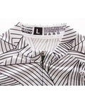 White and black patterned polyester garment with visible care label and size L tag