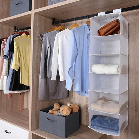 Rock Solid Six Shelf Hanging Closet Organizer With Dividers In Clean White Non Woven Fabric, storing clothes on shelves.