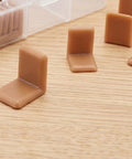 50-Piece Plastic Drawer Sliders Kit With L-Shaped Glides for dresser repair on wood surface